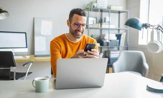 Man at desk with laptop